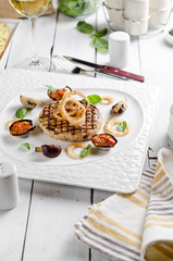 Veal cotoletta with baked vegetables