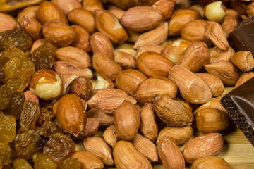 background of mixture of nuts and raisins, closeup