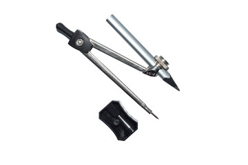 Black color plastic pencil sharpener placed beside a compass attached to a pencil