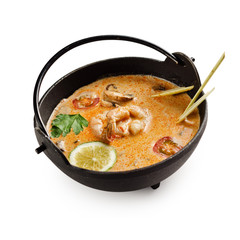 Soup Tom Yam. Thai spicy soup with shrimp and other seafood on a white background