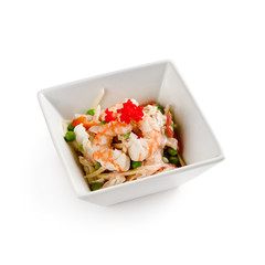 Fresh apple salad with shrimp, peas and flying fish caviar on a white background