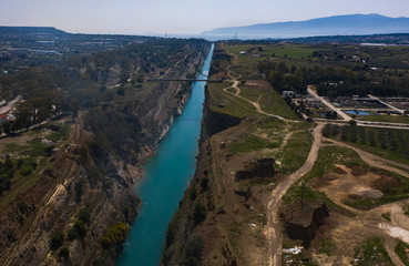 Fototapeta na wymiar The Corinth Canal is a canal that connects the Gulf of Corinth with the Saronic Gulf in the Aegean Sea. It cuts Isthmus of Corinth and separates Peloponnese from the Greek mainland.
