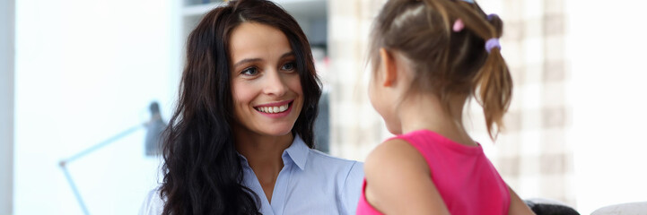 Girl giving present to mum