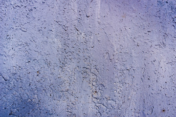 Texture of a rusty metal surface: dark blue, blue, aged cracked paint. Background of old painted sheet metal with rust painted in blue.