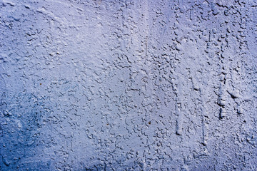 Texture of a rusty metal surface: dark blue, blue, aged cracked paint. Background of old painted sheet metal with rust painted in blue.
