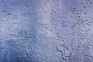 Texture of a rusty metal surface: dark blue, blue, aged cracked paint. Background of old painted sheet metal with rust painted in blue.