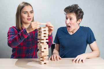 Board game play, couple play risky game. Emotions feeling.