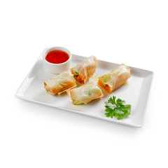 Vietnamese rice paper rolls with carrots, fresh cucumber and sweet pepper. Vietnamese traditional dish. On a white background