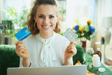 happy elegant woman in modern house in sunny day