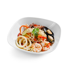 Fried udon noodles in a seafood wok. Traditional asian food. Isolated on a white background.