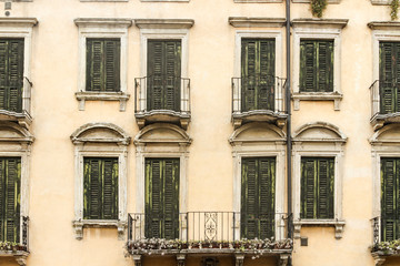 Fototapeta na wymiar Ancient windows exterior Verona, Veneto, Italy
