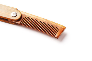 Wooden comb made of natural sandalwood for men on a white background.