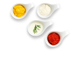 mix of dip sauces, dips, mustard, tzatziki, garlic sauce, tomato sauce