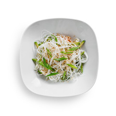 Salad with funchose, fresh vegetables and sesame seeds. Isolated on a white background.