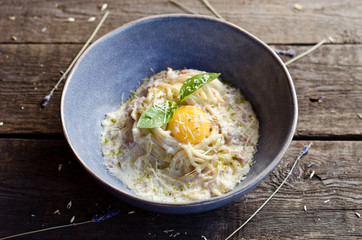 Carbonara pasta with bacon, cream sauce, Parmesan cheese and egg yolk. Traditional italian food.