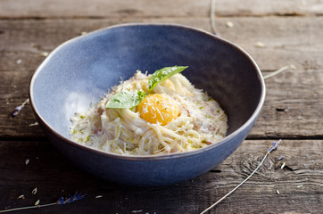 Carbonara pasta with bacon, cream sauce, Parmesan cheese and egg yolk. Traditional italian food.