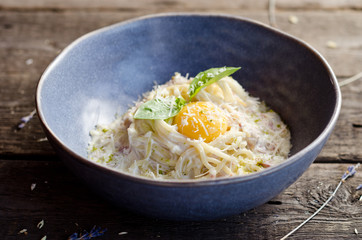 Carbonara pasta with bacon, cream sauce, Parmesan cheese and egg yolk. Traditional italian food.