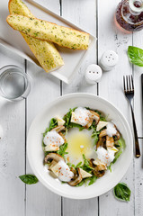 Appetizer with mozzarella cheese, arugula and mushrooms