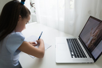 Fototapeta na wymiar little girl studying with laptop online learning