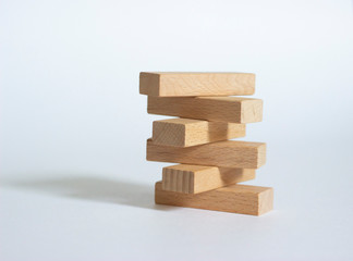 Wooden blocks are isolated on white paper. The concept of business and business games.