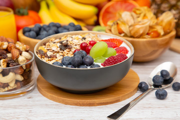 Group Fruits Breakfast mixed vegetables with salad bowl, nuts bowl, strawberry, banana, and pineapple, orange juice,  vitamin c in food  nature for health and diet in the top view on the wood table.