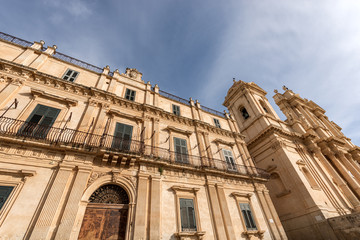 Fototapeta na wymiar Landolina Palace and the Basilica and Cathedral of San Nicolò in Sicilian baroque style. Noto town, UNESCO world heritage site, Siracusa province, Sicily Island, Italy, Europe