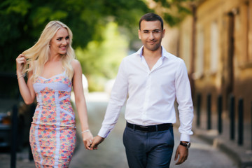 Obraz premium Smiling couple in love outdoors, lviv. summer
