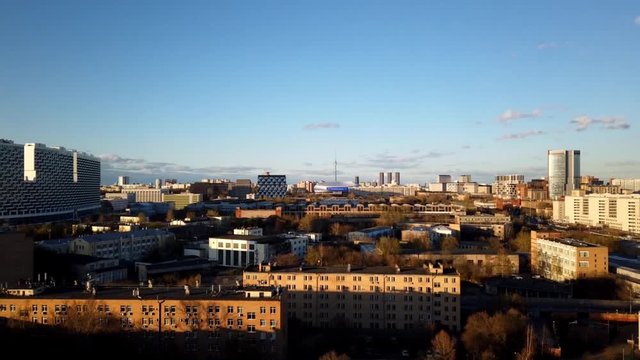 Aerial top view of Moscow timelapse agaist blue sky with clouds