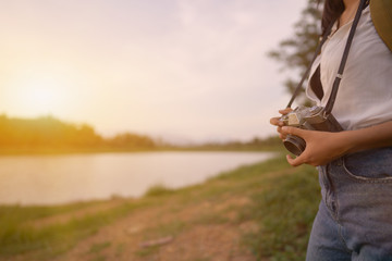 Women carrying cameras and bags ready to travel