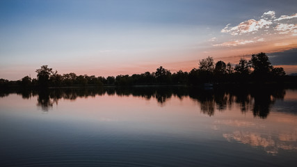 Sunrise with a lake in the foreground