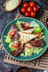 Fresh roastbeef salad with green iceberg and parmesan cheese