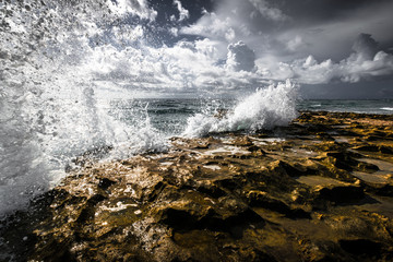 Waves hitting the rocky beach on Singer Island Florida