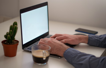 Man writing on the computer