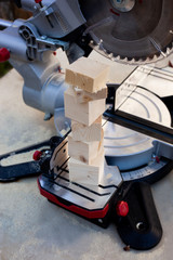 Fototapeta premium Electric tool with circular metal blade for woodworking. Process of sawing a pine wood.