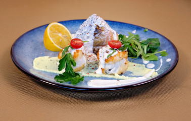 pike perch baked with potato croutons lemon, herbs and Greek sauce