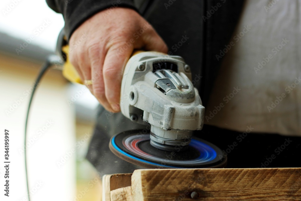 Wall mural man working with electric drill