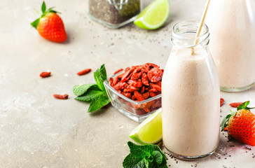 Healthy blended superfood drink. Organic diet smoothie with strawberry and goji berries, chia seeds...