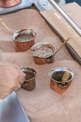 Bucharest, Romania, 21st of September 2019: Turkish coffee made with hot sand preparation