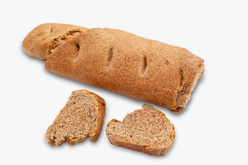 Whole grain bread and slices isolated on white background. The healthy eating and traditional home made concept.