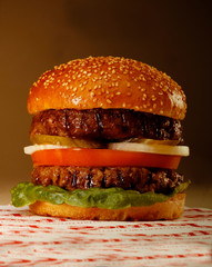 Big mack hamburger on black background
 two-story burger is a great burger