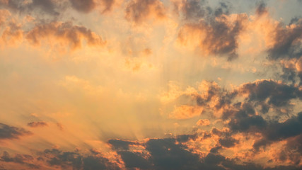 Beautiful orange colours and light rays in sky during sunset