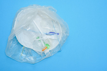 White plastic on a blue background. Plastic pollution. Recycling plastic, reusable packing, sorting garbage concept. Zero waste, ecology. Copyspase,