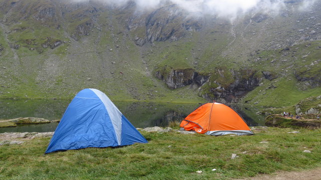 Camping at a Mountain Lake in a Misty Landscape

