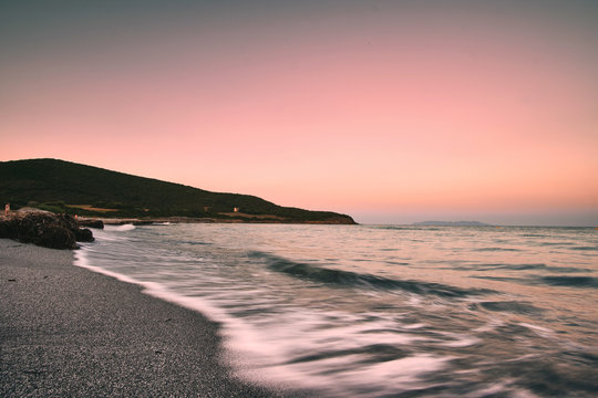 dramatic sunset Plage de tamarone beach near cap corse, mediterranean france island
