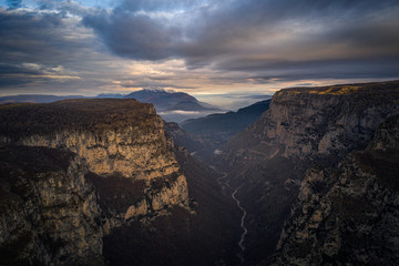 Fototapeta na wymiar Aerial view of Vikos Gorge, a gorge in the Pindus Mountains of northern Greece at sunset time