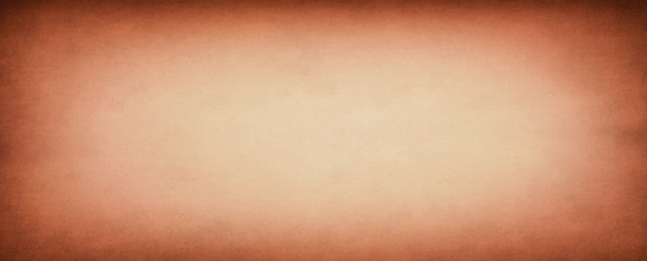 Orange old paper background with distressed grunge texture and soft light center