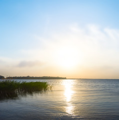 Fototapeta premium dramatic sunset over quiet lake