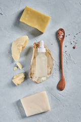 Natural ingredients and accessories for diy cosmetics and home spa treatment on turquoise background, top view.