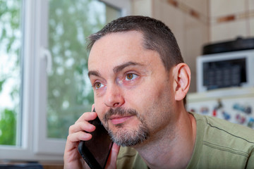 handsome business man working from home during the coronavirus outbreak. Covid-19 personal protection and social distancing