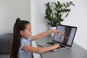 cheerfully cute girl children excited using computer learning schoolwork. kid enjoy e-learning in...
